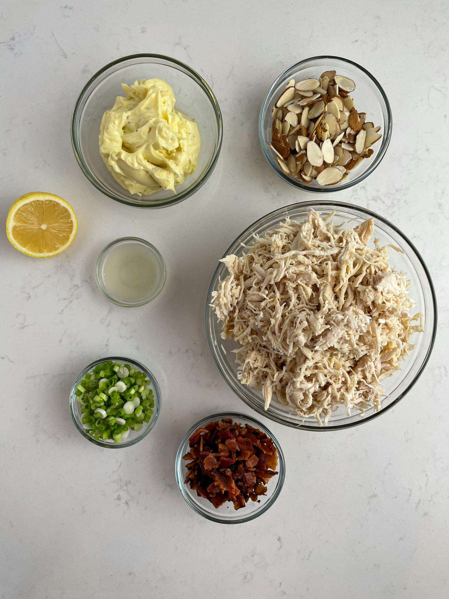Chicken salad ingredients laid out on table