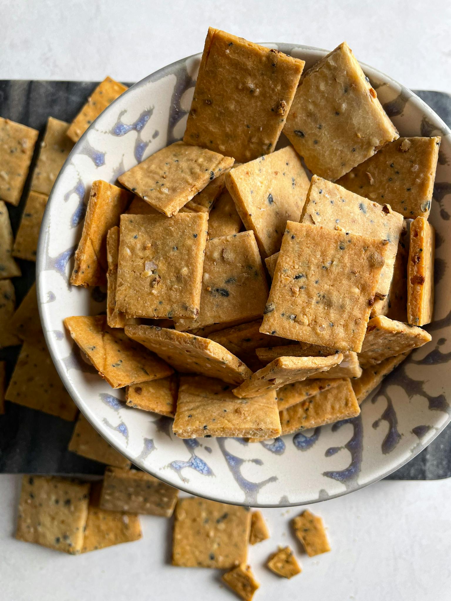 Everything bagel crackers in a small bowl.